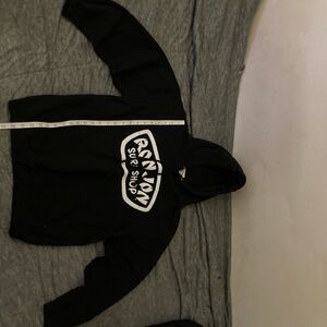Black Ron Jon surf shop hoodie size medium with a white spell out on the front